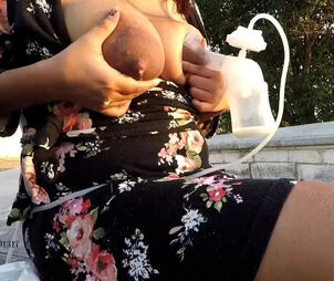 Promiscuous mother pumping out milk from juggs in public..