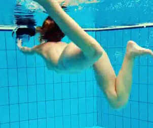 Pornography shooting underwater. Naked Youngster undresses